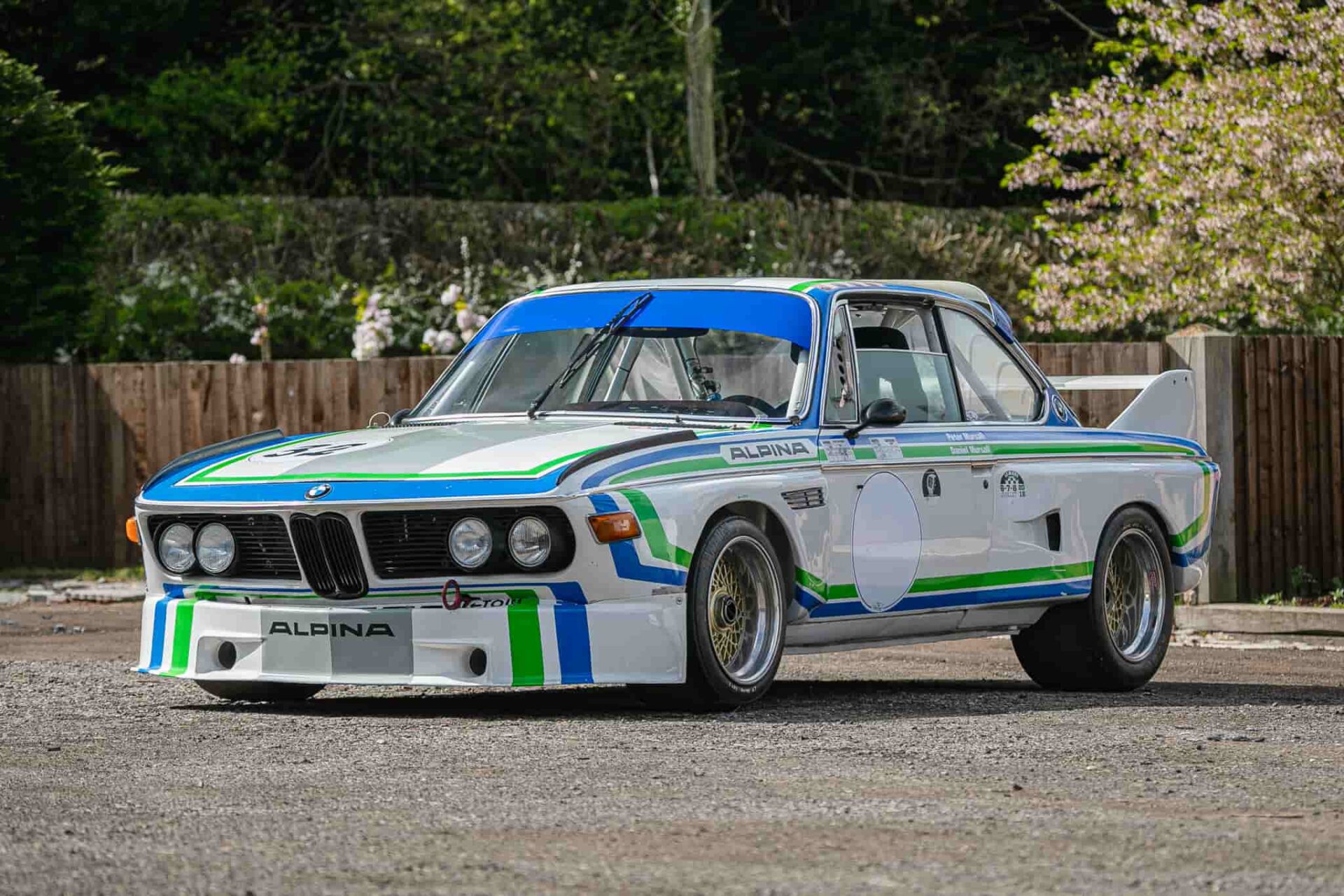 A 1973 BMW, once owned by Jamiroquai's Jay Kay, sold for £151,875 at auction. The 'CSL Batmobile' has a rich racing history and was auctioned at Sywell Aerodrome.