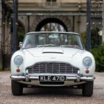 A rare 1965 Aston Martin DB5, one of 123 made, is up for auction. Known for its James Bond fame, this platinum convertible is estimated at over £800,000.