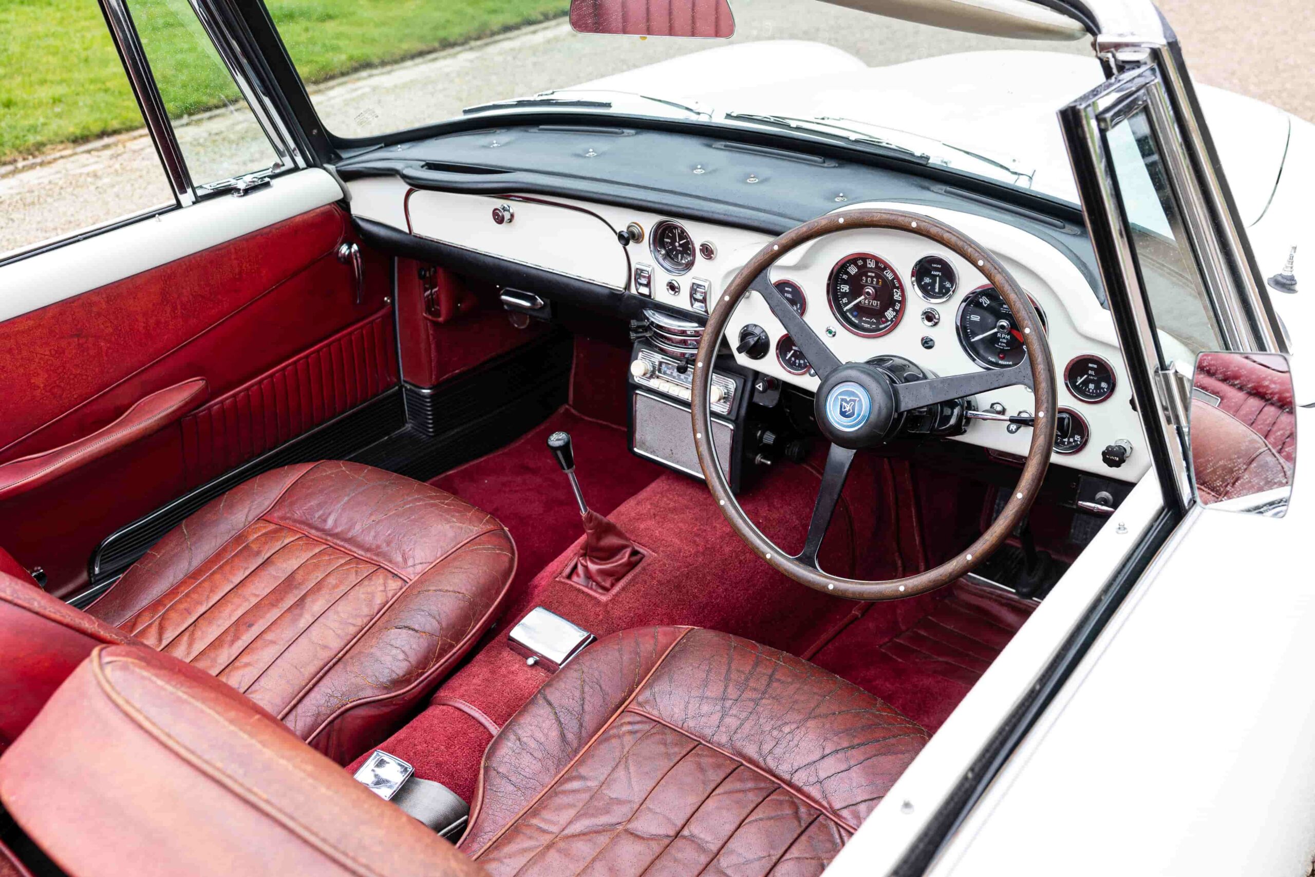 A rare 1965 Aston Martin DB5, one of 123 made, is up for auction. Known for its James Bond fame, this platinum convertible is estimated at over £800,000.