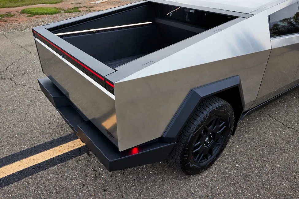 A futuristic Tesla Cyberbeast pickup truck, likened to the DeLorean, is debuting at auction. With a 0-60 mph in 2.68 seconds and a range of 340 miles, it's a collector's dream.
