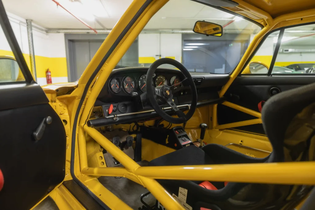 A 1996 Porsche 911 GT2 with just 30 miles on the odometer is set to be auctioned for £1.4 million. This vibrant Speed Yellow, 480 bhp car is a rare collector's gem.