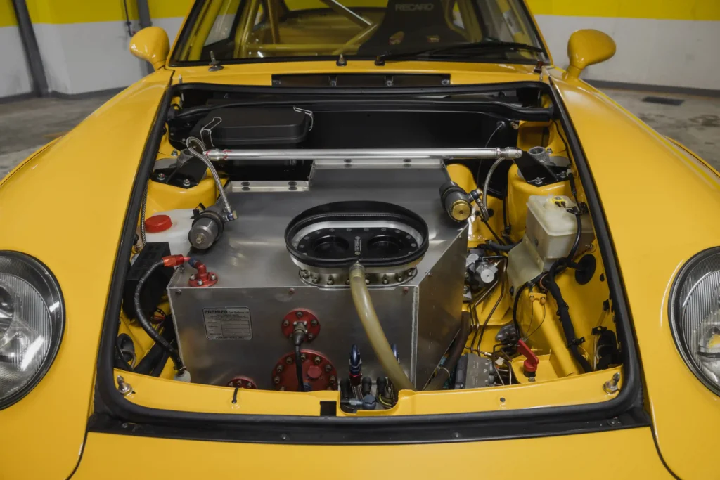 A 1996 Porsche 911 GT2 with just 30 miles on the odometer is set to be auctioned for £1.4 million. This vibrant Speed Yellow, 480 bhp car is a rare collector's gem.