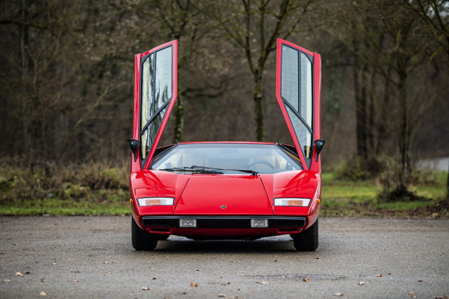 Rod Stewart’s 1977 Lamborghini Countach LP400, expected to sell for nearly £1 million, highlights an auction of 87 luxury cars, including a Bugatti Chiron and Ferrari Enzo.