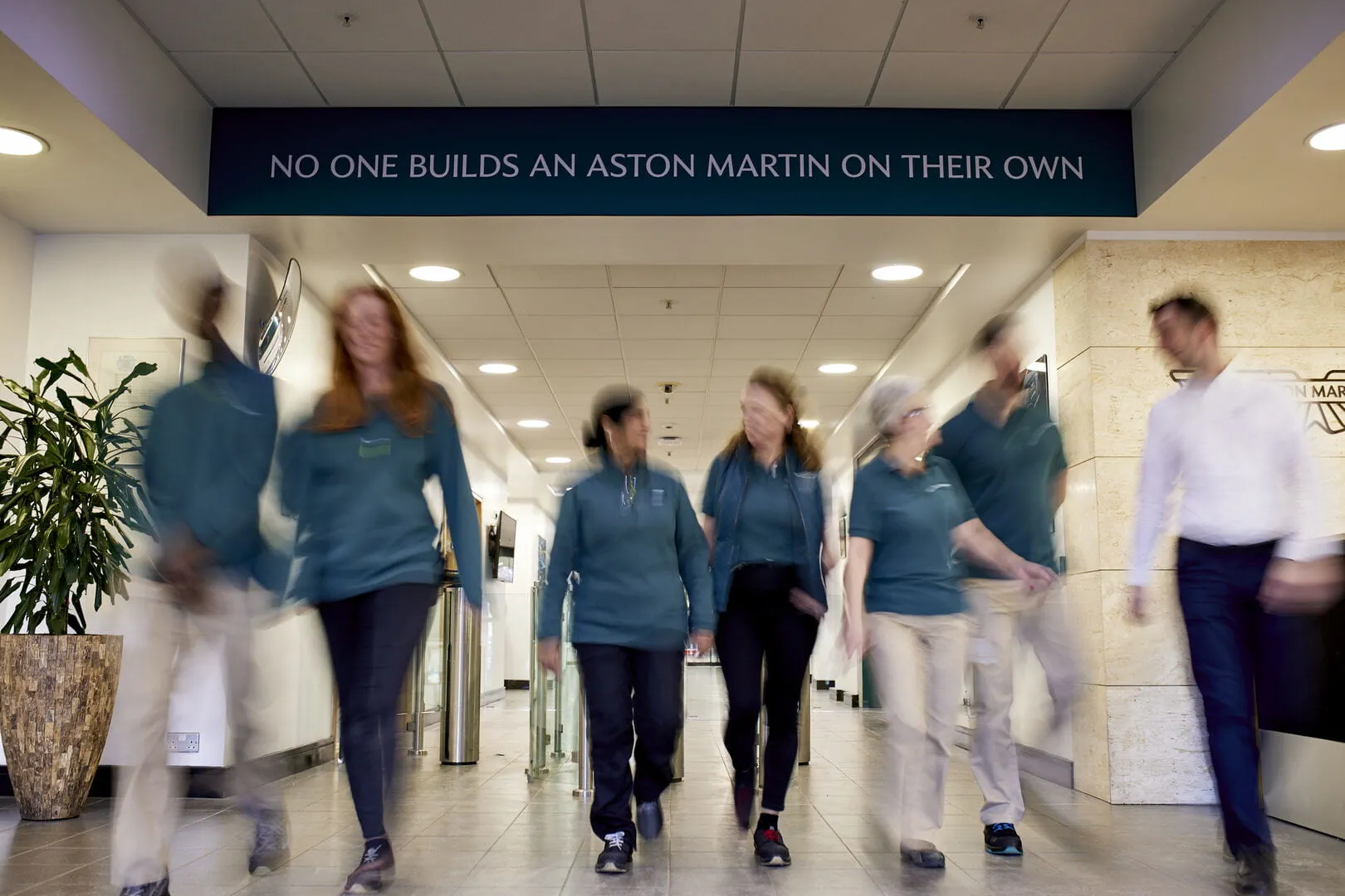 Aston Martin announces a two-year agreement for 2,500 UK workers, including a 4% annual pay raise, reduced working hours, and a £1,000 bonus to support employee wellbeing amidst rising living costs.