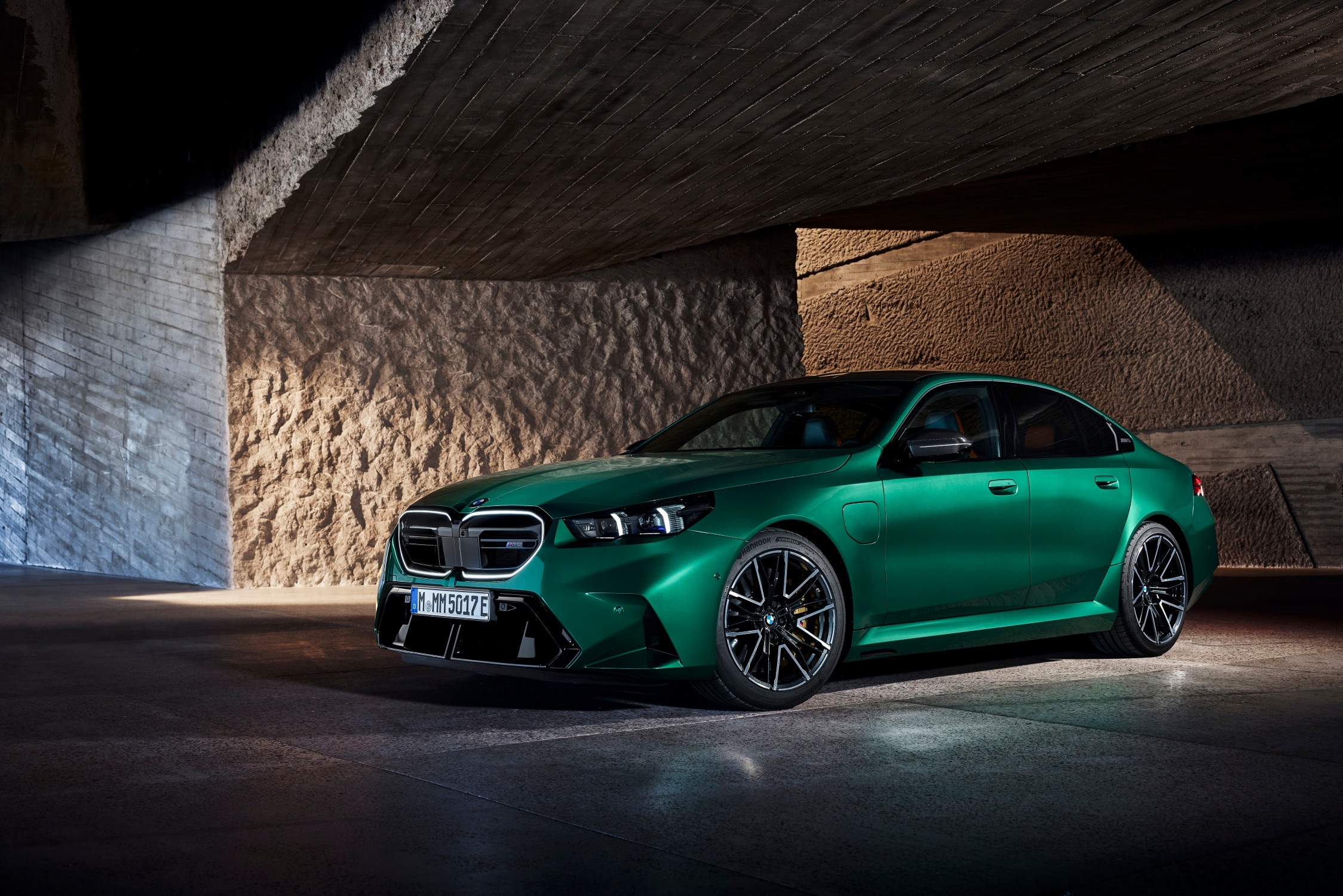 The iconic BMW M5's seventh generation debuts an electrified drive system, combining a 4.4-liter V8 engine and electric motor for 727 hp, 0-100 km/h in 3.5 seconds, and a 67 km electric range.
