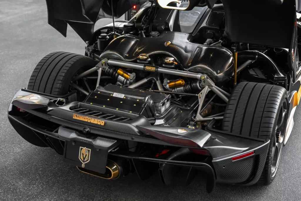 Koenigsegg 251mph supercar with gold leaf accents and 1,500 bhp engine for sale at £2.57m. Rare model, stunning modifications, and low mileage heading to auction in Monterey.