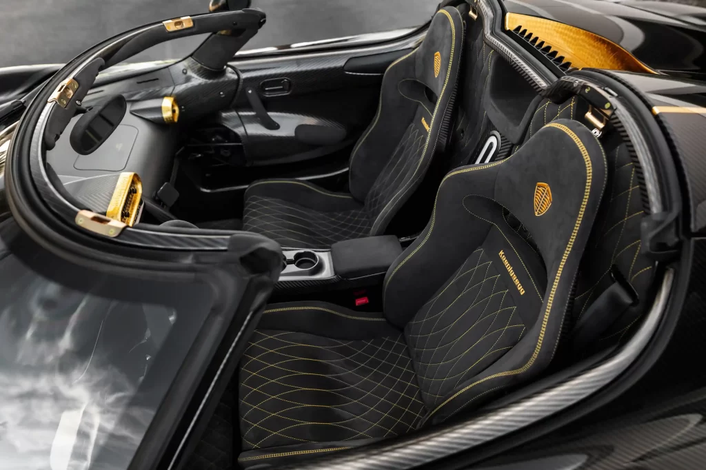 Koenigsegg 251mph supercar with gold leaf accents and 1,500 bhp engine for sale at £2.57m. Rare model, stunning modifications, and low mileage heading to auction in Monterey.