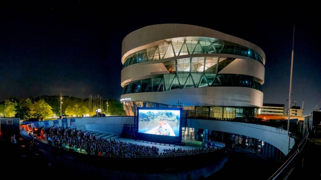 The Mercedes-Benz Museum's 2024 summer program features diverse events like Family Day, Urban Culture, and open-air cinema. Highlights include classic car meets and an after-work special.