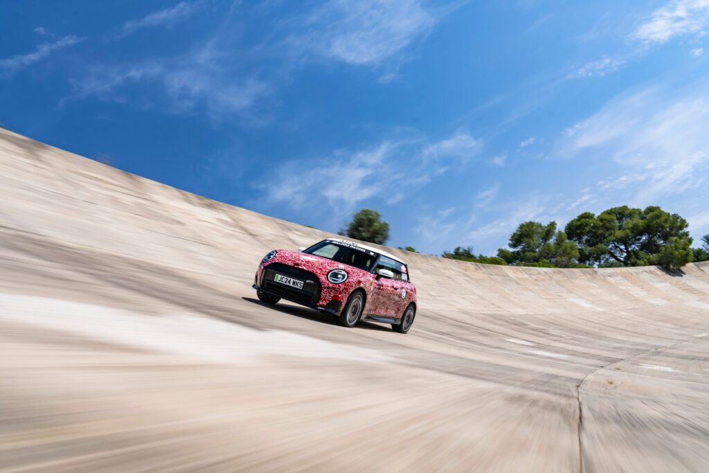 The MINI John Cooper Works E Prototype, the first electric model in the lineup, debuted at the Goodwood Festival of Speed, showcasing MINI's innovation and commitment to electromobility with advanced design and technology.