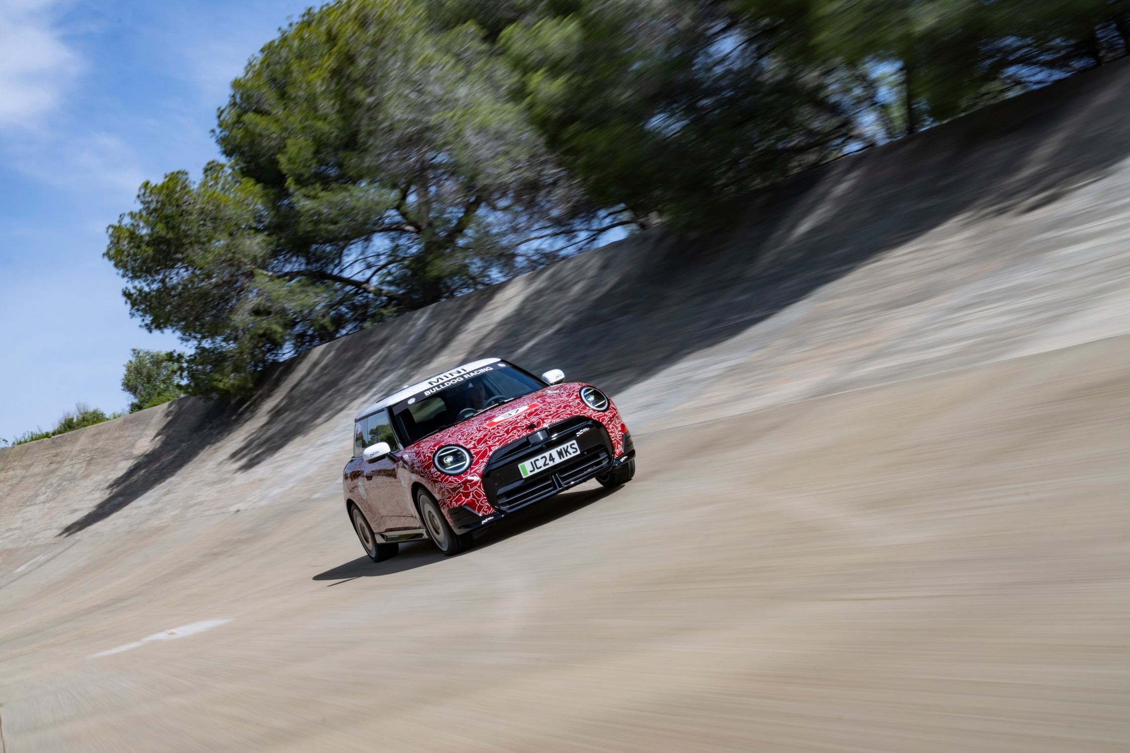 The MINI John Cooper Works E Prototype, the first electric model in the lineup, debuted at the Goodwood Festival of Speed, showcasing MINI's innovation and commitment to electromobility with advanced design and technology.