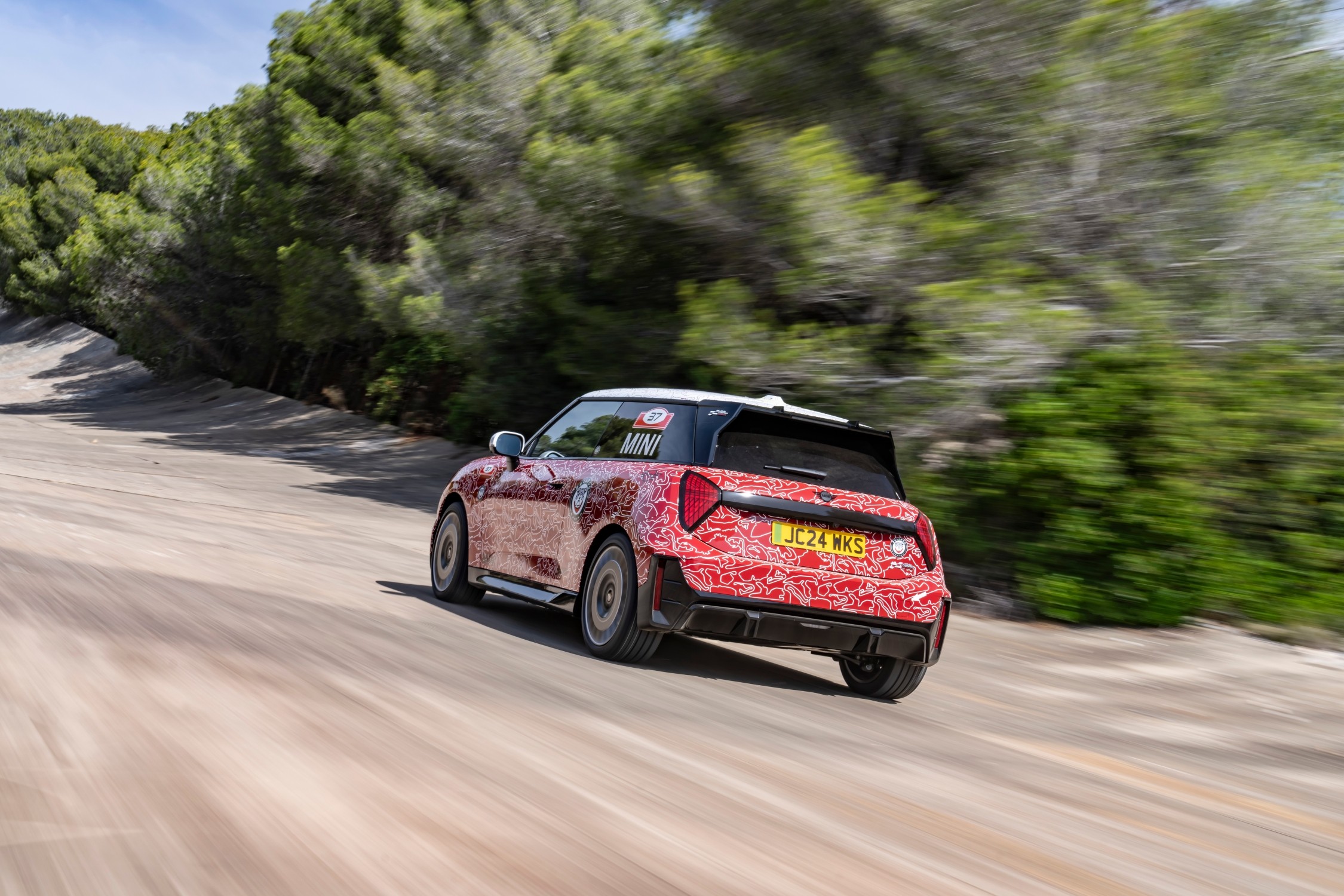 The MINI John Cooper Works E Prototype, the first electric model in the lineup, debuted at the Goodwood Festival of Speed, showcasing MINI's innovation and commitment to electromobility with advanced design and technology.