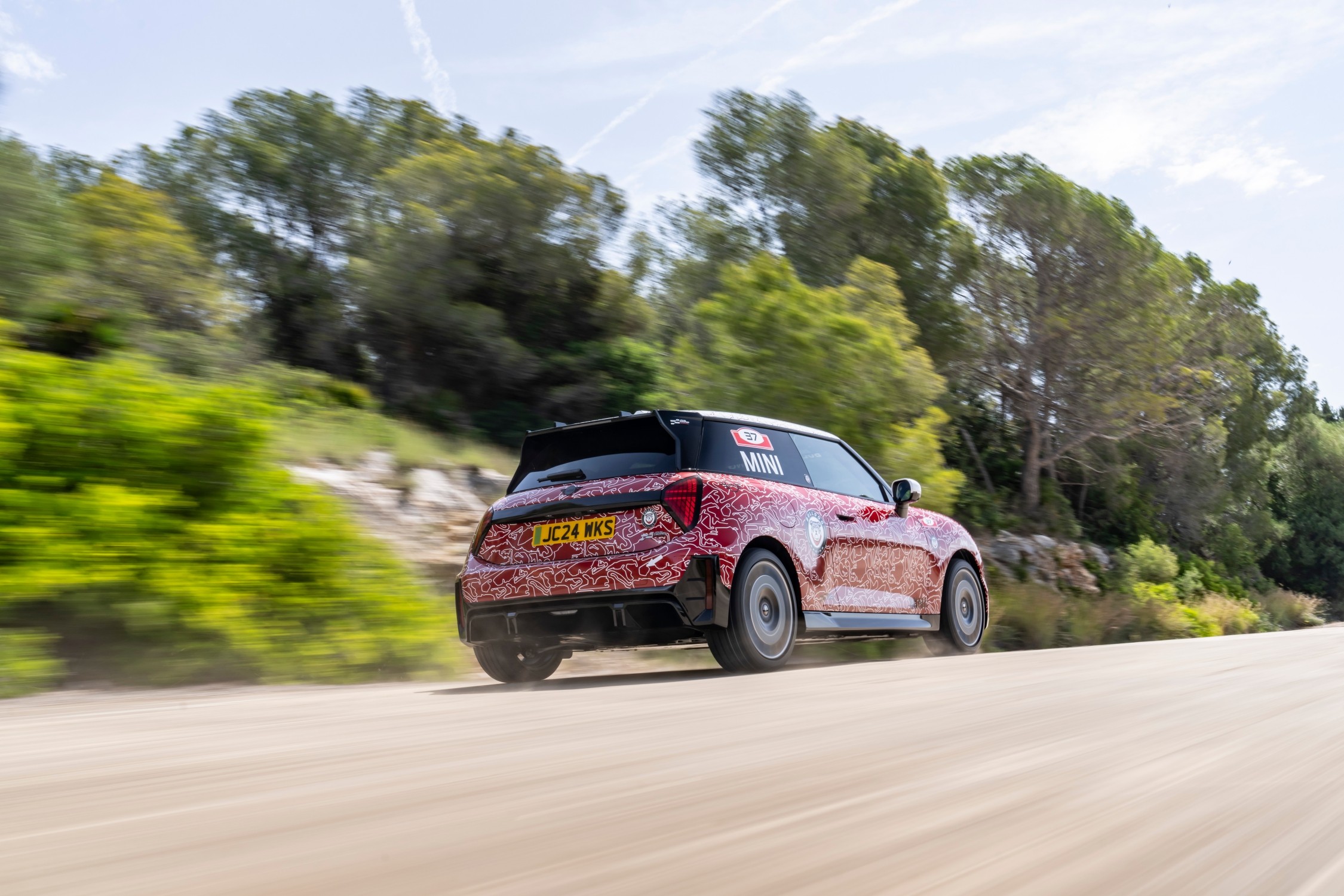 The MINI John Cooper Works E Prototype, the first electric model in the lineup, debuted at the Goodwood Festival of Speed, showcasing MINI's innovation and commitment to electromobility with advanced design and technology.