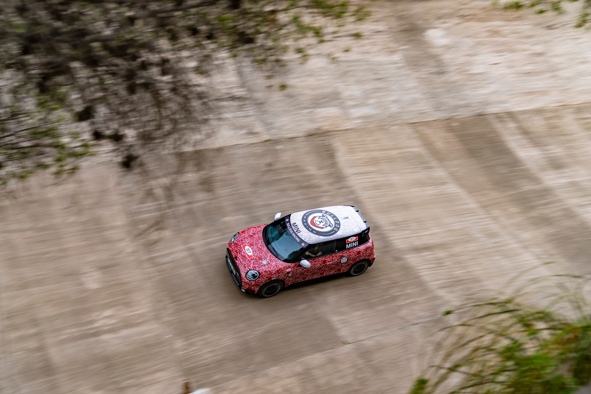 The MINI John Cooper Works E Prototype, the first electric model in the lineup, debuted at the Goodwood Festival of Speed, showcasing MINI's innovation and commitment to electromobility with advanced design and technology.