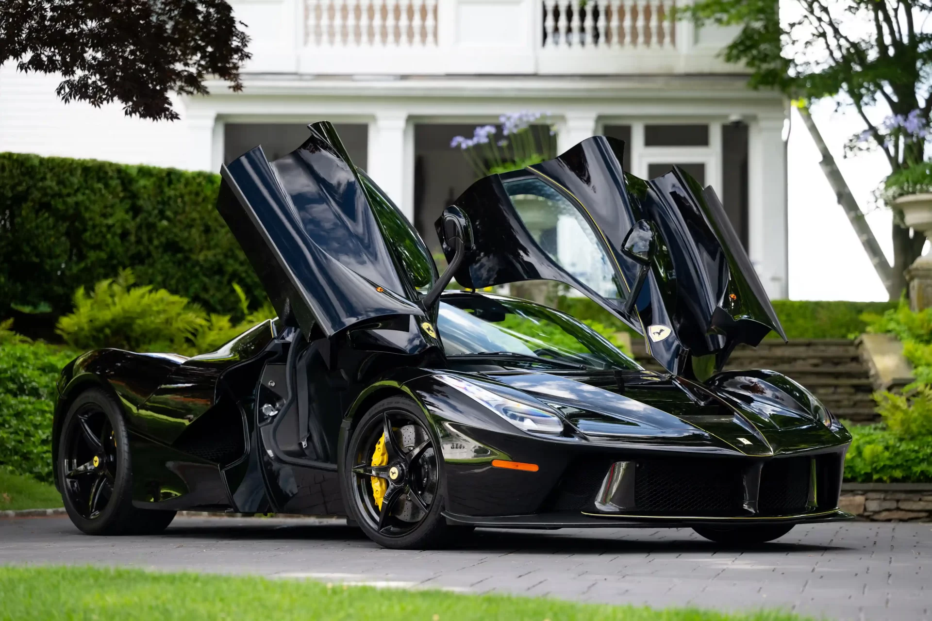 A rare black LaFerrari, the first hybrid road car by Ferrari, is for sale at £3.1 million. With under 5,000 miles, it boasts a 6.2L V-12 engine and a 120-kW electric motor.