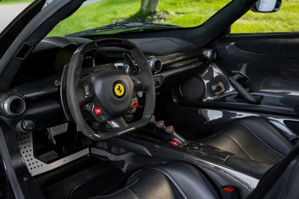 A rare black LaFerrari, the first hybrid road car by Ferrari, is for sale at £3.1 million. With under 5,000 miles, it boasts a 6.2L V-12 engine and a 120-kW electric motor.