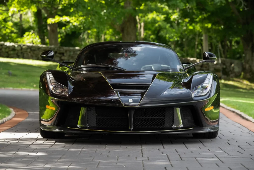 A rare black LaFerrari, the first hybrid road car by Ferrari, is for sale at £3.1 million. With under 5,000 miles, it boasts a 6.2L V-12 engine and a 120-kW electric motor.