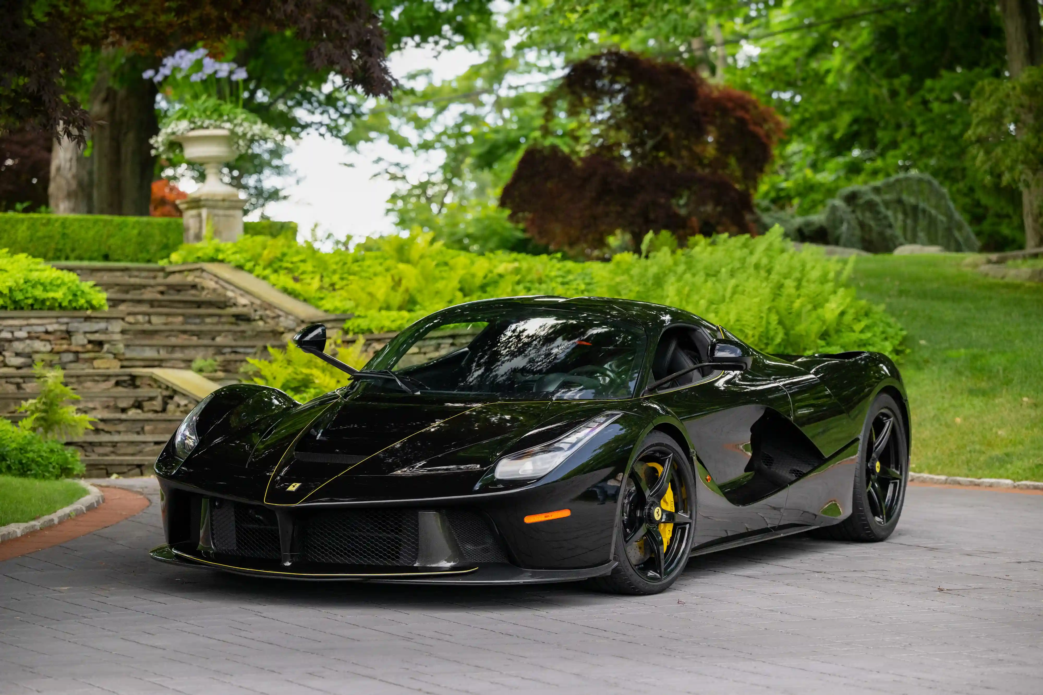 A rare black LaFerrari, the first hybrid road car by Ferrari, is for sale at £3.1 million. With under 5,000 miles, it boasts a 6.2L V-12 engine and a 120-kW electric motor.