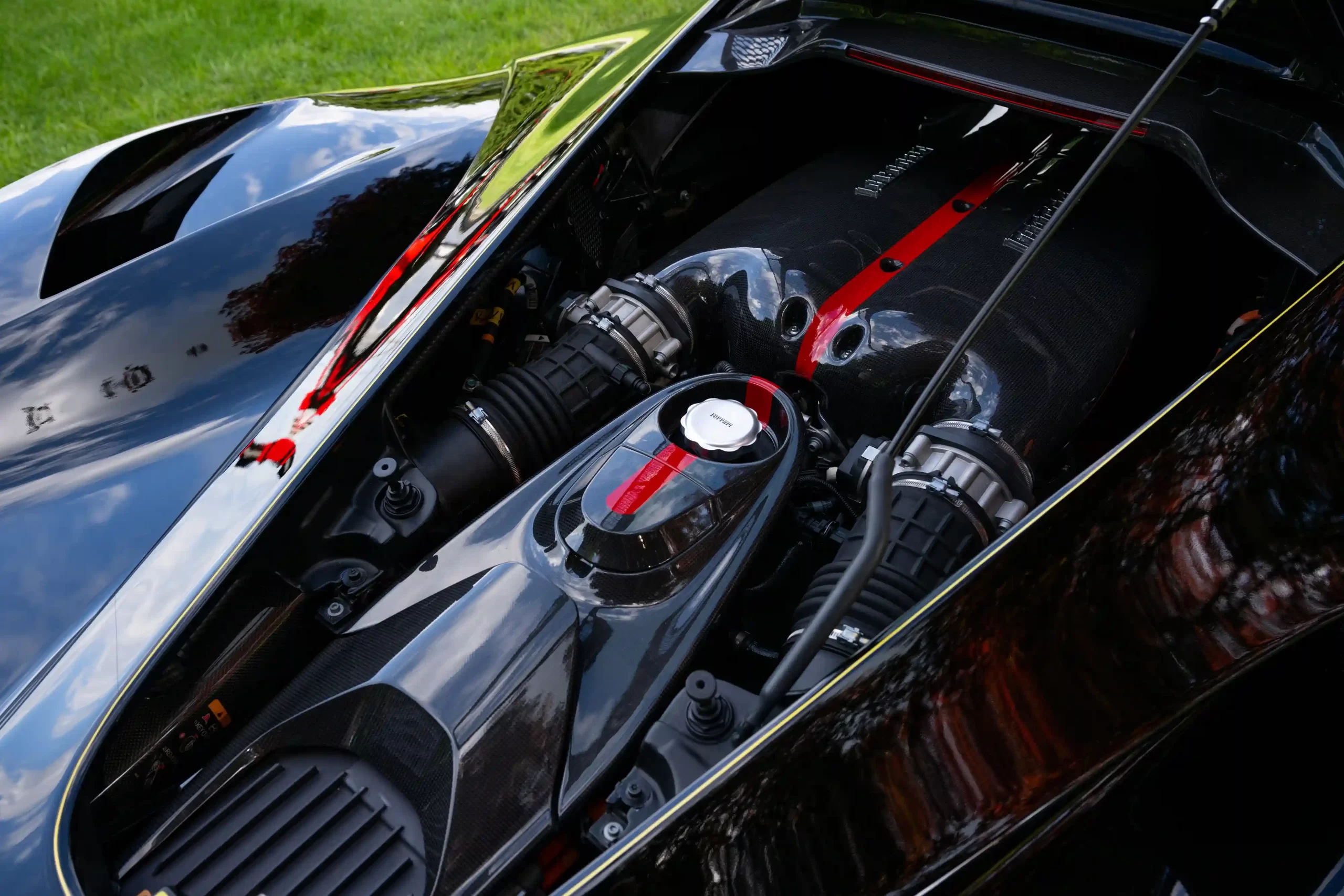 A rare black LaFerrari, the first hybrid road car by Ferrari, is for sale at £3.1 million. With under 5,000 miles, it boasts a 6.2L V-12 engine and a 120-kW electric motor.