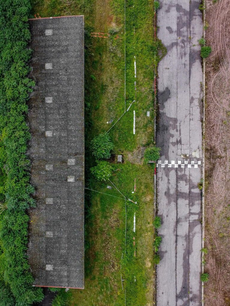 Explorer Chloe Urbex discovers an abandoned Essex racetrack reclaimed by nature, sparking nostalgic memories among locals. See photos and reactions to this hidden gem.