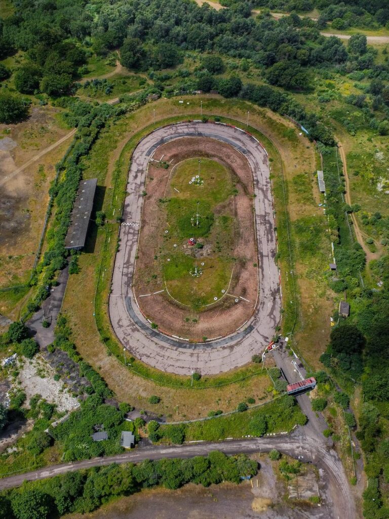 Explorer Chloe Urbex discovers an abandoned Essex racetrack reclaimed by nature, sparking nostalgic memories among locals. See photos and reactions to this hidden gem.