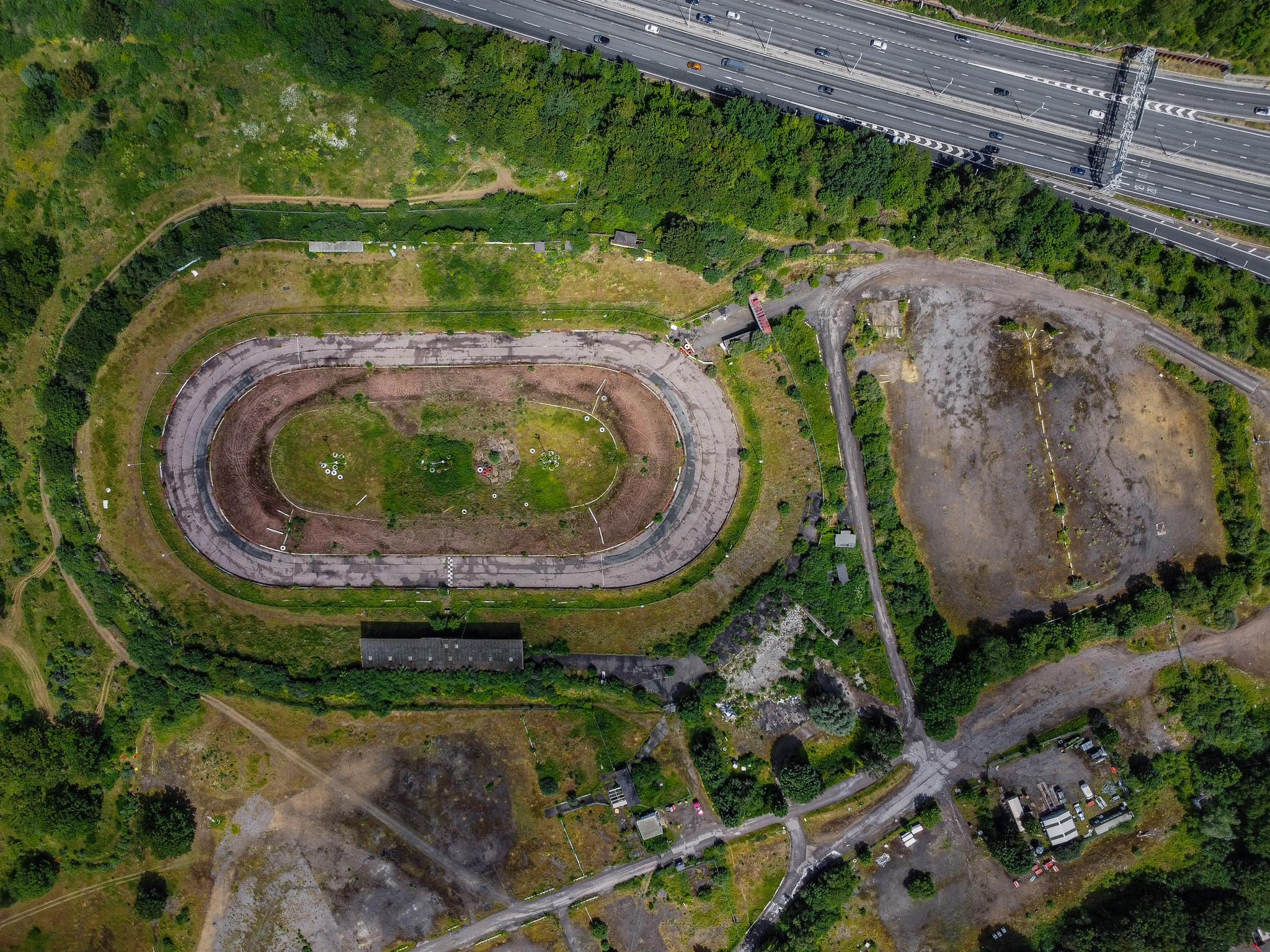 Explorer Chloe Urbex discovers an abandoned Essex racetrack reclaimed by nature, sparking nostalgic memories among locals. See photos and reactions to this hidden gem.