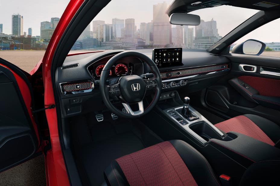 The 2025 Honda Civic Si, releasing this summer, features aggressive styling, advanced tech with Google built-in, improved dynamics, and is the only car in its class with a manual transmission.