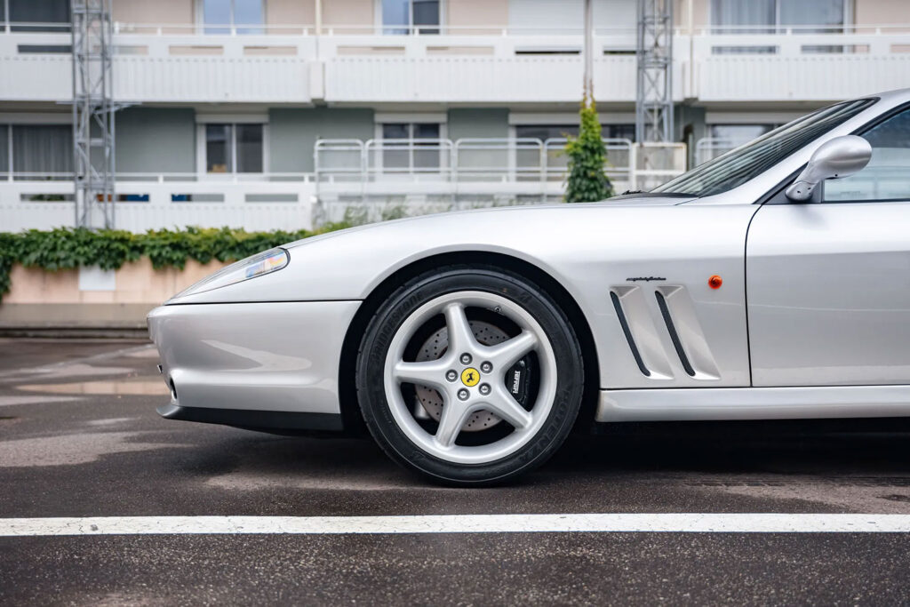 Michael Schumacher's 1996 Ferrari 550 Maranello, signed by the legend himself, is up for auction at £350,000. This rare car boasts a 5.5L V12 engine and low mileage.