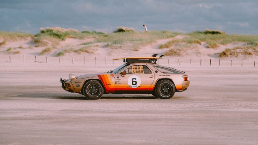 The Porsche 928 Surfari, created by a Polish surfing community, blends a powerful V8 engine with off-road capabilities, offering the ultimate beach and surf experience.