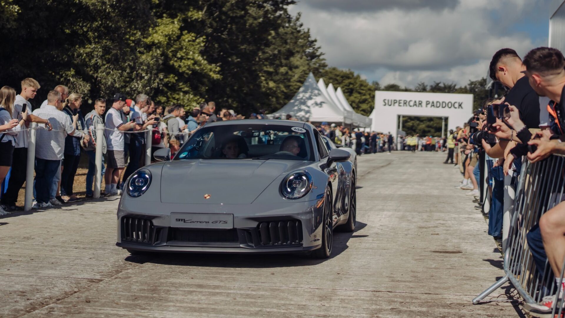 Porsche dazzled visitors at the 2024 Goodwood Festival of Speed, showcasing the new 992-generation 911, all-electric Macan, and Taycan Turbo GT, highlighting their commitment to innovation and performance.