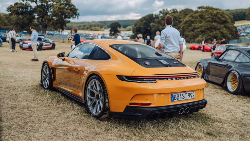 Porsche dazzled visitors at the 2024 Goodwood Festival of Speed, showcasing the new 992-generation 911, all-electric Macan, and Taycan Turbo GT, highlighting their commitment to innovation and performance.