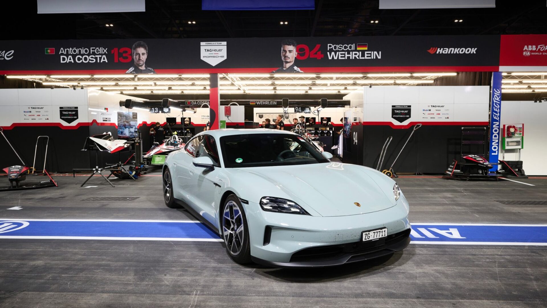 A road trip from Zurich to the Formula E finale in London showcased the Porsche Taycan's exceptional electric performance and efficiency, covering over 2,000 km with minimal charging stops.