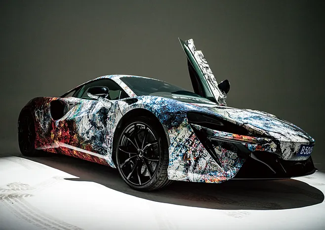 The "ROARING INTO THE FUTURE" exhibition at McLaren Showroom in Kuala Lumpur showcased a collaboration between McLaren, Jaee Tee, and Mitsuhiro Higuchi, celebrating the Tiger's courage and McLaren's legacy.