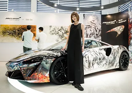 The "ROARING INTO THE FUTURE" exhibition at McLaren Showroom in Kuala Lumpur showcased a collaboration between McLaren, Jaee Tee, and Mitsuhiro Higuchi, celebrating the Tiger's courage and McLaren's legacy.