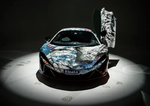 The "ROARING INTO THE FUTURE" exhibition at McLaren Showroom in Kuala Lumpur showcased a collaboration between McLaren, Jaee Tee, and Mitsuhiro Higuchi, celebrating the Tiger's courage and McLaren's legacy.