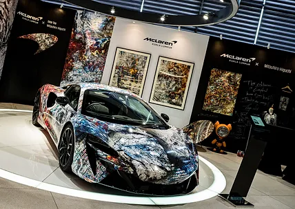 The "ROARING INTO THE FUTURE" exhibition at McLaren Showroom in Kuala Lumpur showcased a collaboration between McLaren, Jaee Tee, and Mitsuhiro Higuchi, celebrating the Tiger's courage and McLaren's legacy.