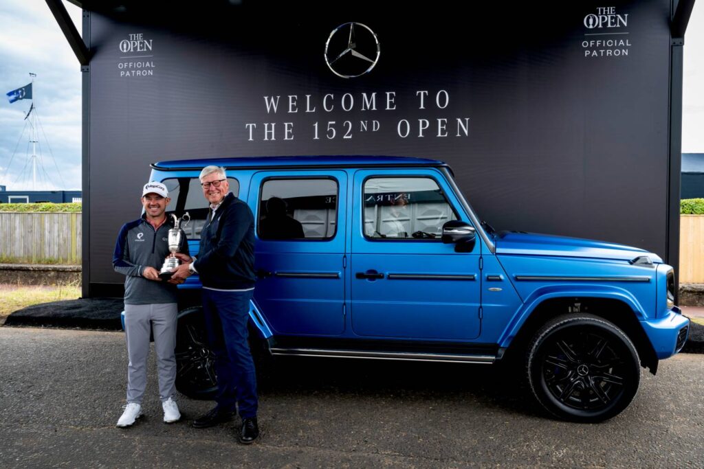 The defending champion of The Open returns the Claret Jug in the new electric G-Class from Mercedes-Benz, highlighting the blend of tradition and innovation in their ongoing collaboration.