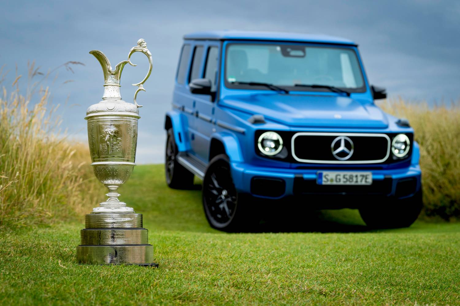 The defending champion of The Open returns the Claret Jug in the new electric G-Class from Mercedes-Benz, highlighting the blend of tradition and innovation in their ongoing collaboration.