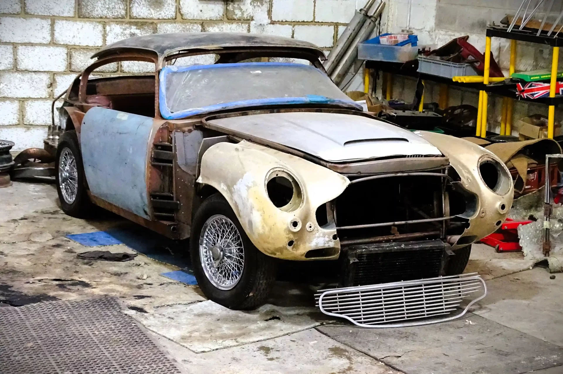 A vintage 1967 Aston Martin DB6, a stalled restoration project, is up for auction at £100,000. Despite corrosion, extensive welding is done. Auction on 24 July in Derbyshire.