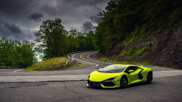 The 2024 Lamborghini Revuelto blends V-12 power with hybrid technology, delivering thrilling performance both on the track and the street, while offering a modern, eco-friendly twist.