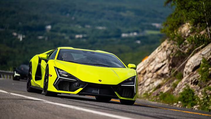 The 2024 Lamborghini Revuelto blends V-12 power with hybrid technology, delivering thrilling performance both on the track and the street, while offering a modern, eco-friendly twist.