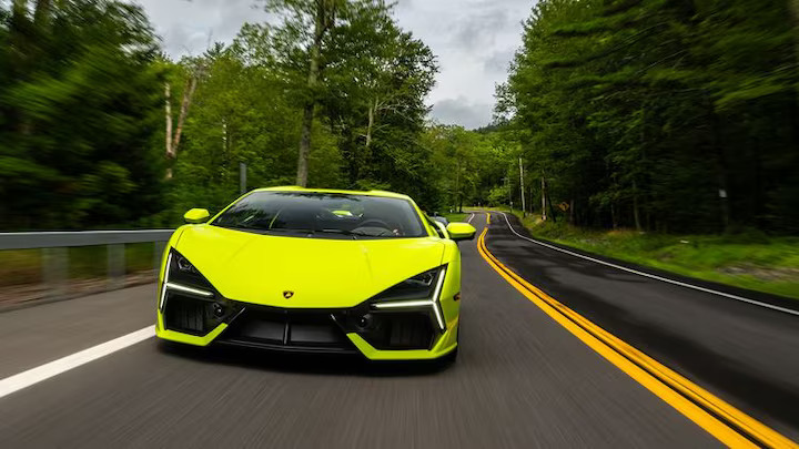 The 2024 Lamborghini Revuelto blends V-12 power with hybrid technology, delivering thrilling performance both on the track and the street, while offering a modern, eco-friendly twist.