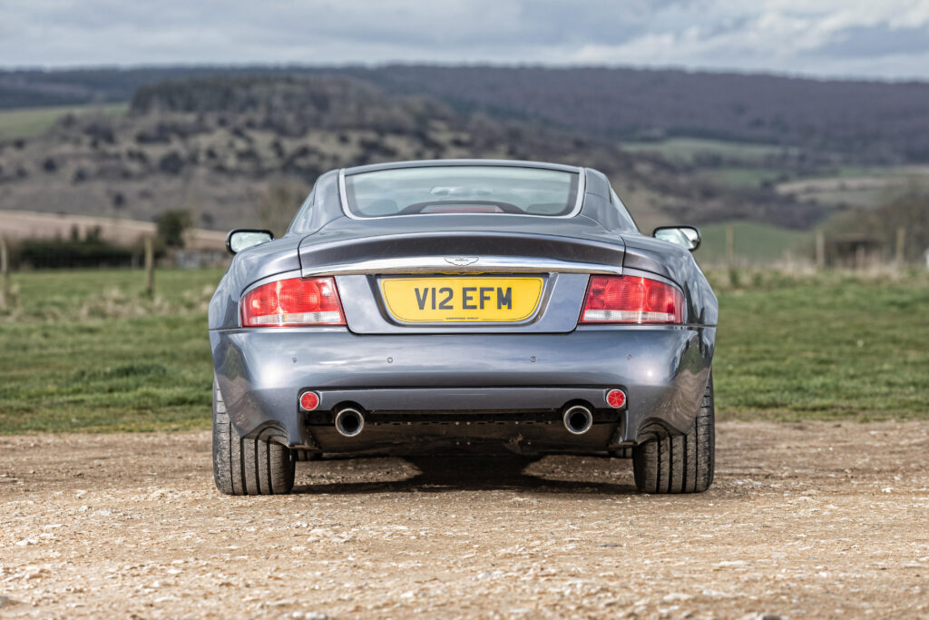 Hugh Grant's 2002 Aston Martin Vanquish heads to auction, expected to fetch £65,000. The sleek sports car, featured in 'About a Boy,' has just 39,300 miles on the clock.