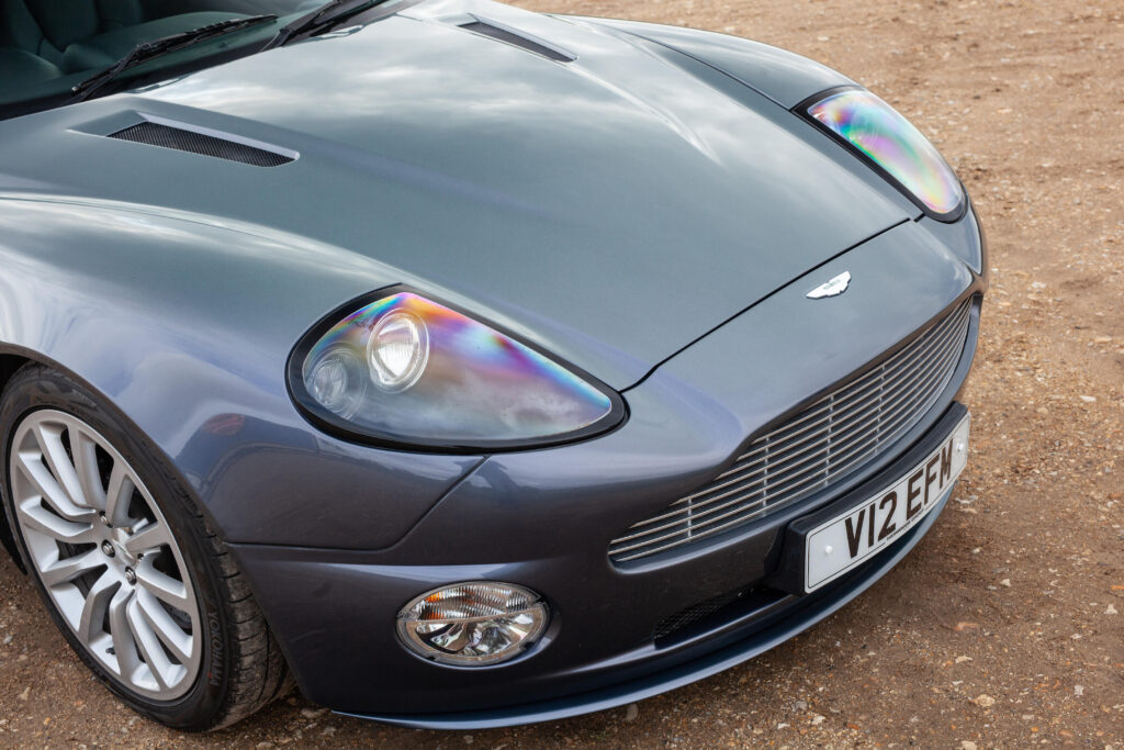 Hugh Grant's 2002 Aston Martin Vanquish heads to auction, expected to fetch £65,000. The sleek sports car, featured in 'About a Boy,' has just 39,300 miles on the clock.