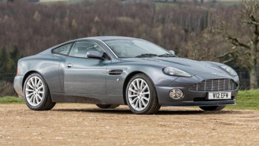 Hugh Grant's 2002 Aston Martin Vanquish heads to auction, expected to fetch £65,000. The sleek sports car, featured in 'About a Boy,' has just 39,300 miles on the clock.