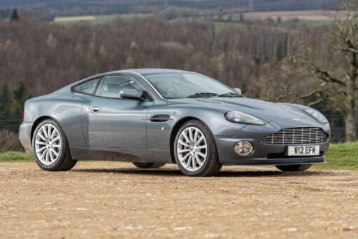 Hugh Grant's 2002 Aston Martin Vanquish heads to auction, expected to fetch £65,000. The sleek sports car, featured in 'About a Boy,' has just 39,300 miles on the clock.