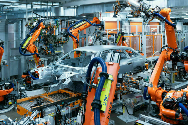 Audi's Neckarsulm plant begins producing the new A5 with sustainable practices, aiming for net carbon-neutral production by 2025, featuring advanced automation and eco-friendly technology.