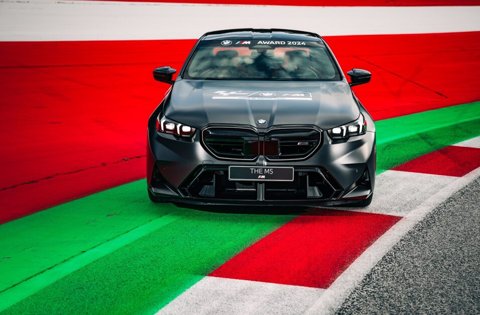 BMW unveils the all-new M5 as the 2024 MotoGP M Award prize, a 727 hp hybrid vehicle awarded to the season's fastest qualifier, continuing BMW's legacy of performance excellence.