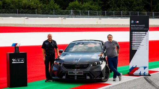 BMW unveils the all-new M5 as the 2024 MotoGP M Award prize, a 727 hp hybrid vehicle awarded to the season's fastest qualifier, continuing BMW's legacy of performance excellence.