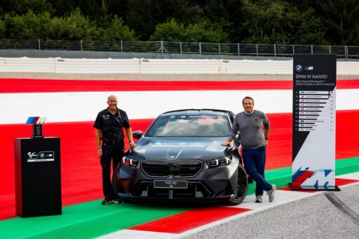 BMW unveils the all-new M5 as the 2024 MotoGP M Award prize, a 727 hp hybrid vehicle awarded to the season's fastest qualifier, continuing BMW's legacy of performance excellence.