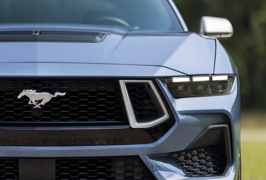 Ford celebrates the Mustang’s 60th anniversary with a special edition package featuring the iconic Brittany Blue paint, limited to 1,965 units, offering a blend of heritage and modern performance.